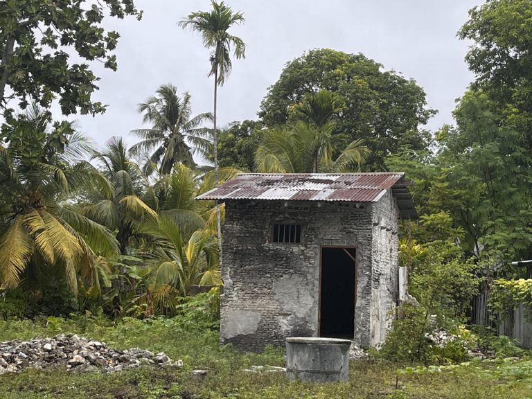 Coral and limestone abandoned cabin with well