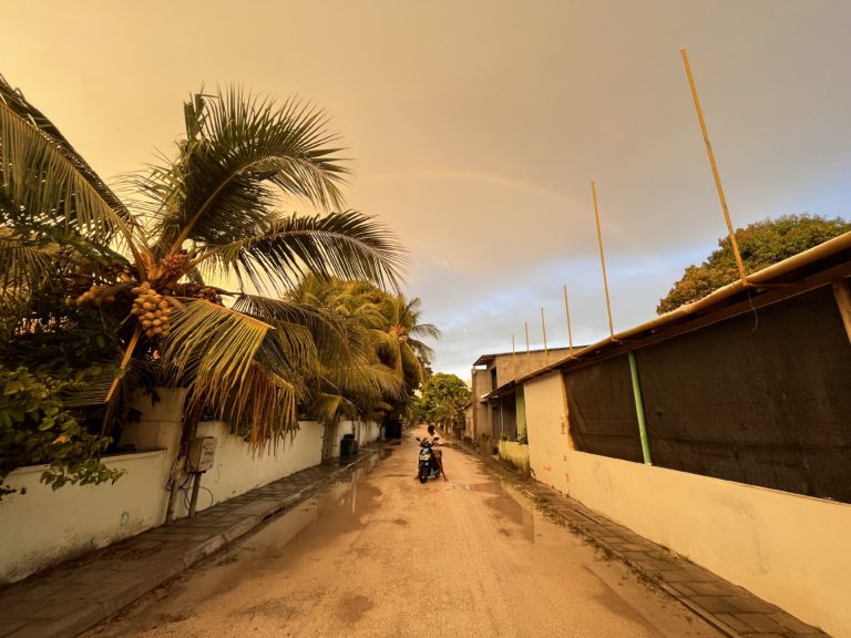 Cloudy sunset with rainbow